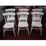A set of six painted pine dining chairs
