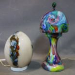 A 20th century multi coloured marbled glass mushroom lamp, together with a glass egg lamp