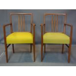A pair of 20th century Gordon Russell teak carver chairs