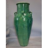 A Persian green glazed Sharab wine vessel, H.78cm