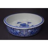 A large 20th century Chinese blue and white porcelain dish, the interior decorated with bats and