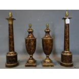 A pair of toleware column table lamps, H.60cm, together with a pair of similar urn table lamps, H.