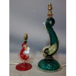 A 20th century Murano green glass dolphin lamp, together with a smaller red example