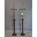 A pair of two sconce lamps on candlestick bases, with no shades, H.103cm