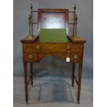 A George III mahogany clerks desk, with brass gallery top, raised on tapered legs and castors, H.130