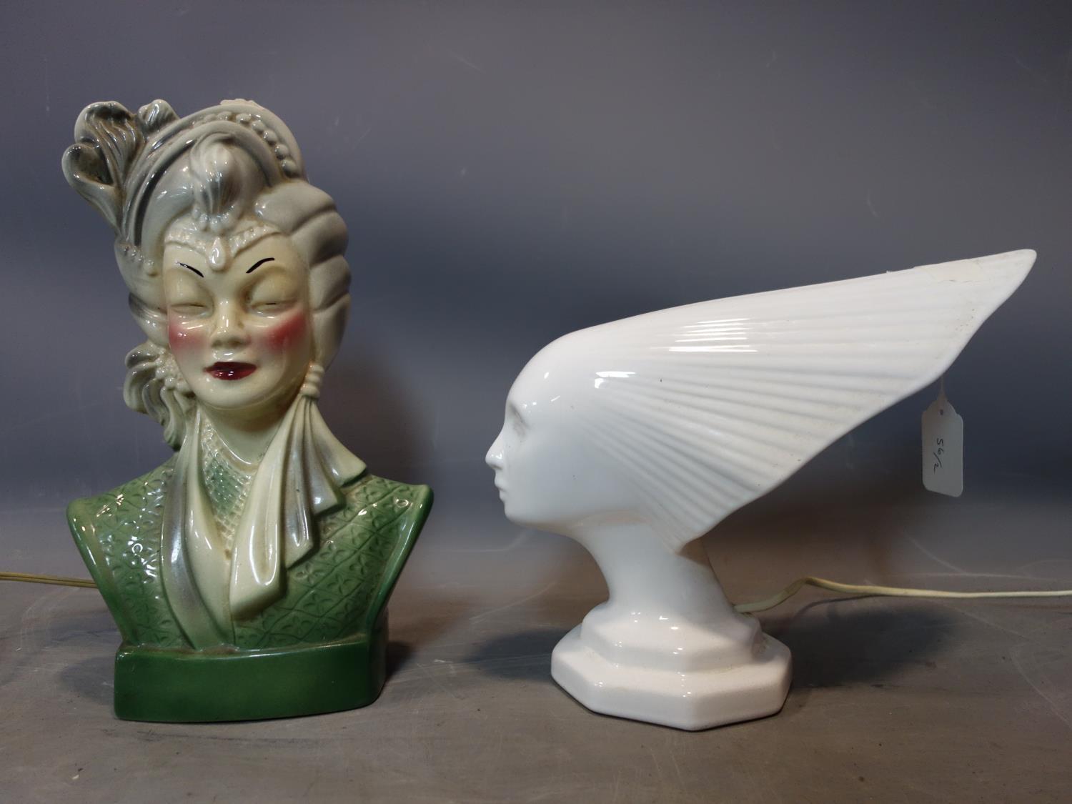 A vintage white ceramic lamp in the form of the spirit of the wind, together with a ceramic bust