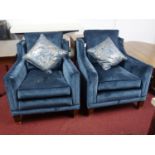 A pair of Duresta 'Trafalgar' armchairs, blue velvet upholstery, raised on tapered legs and brass