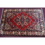 A North west Persian Borchalue rug, the central floral medallion with four corner floral motifs,