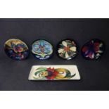 Five Moorcroft pin dishes, various designs, dated 1998-2004