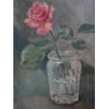 A 20th century oil on canvas of a rose in a glass of water, signed Phyll Nunn, 35 x 24cm