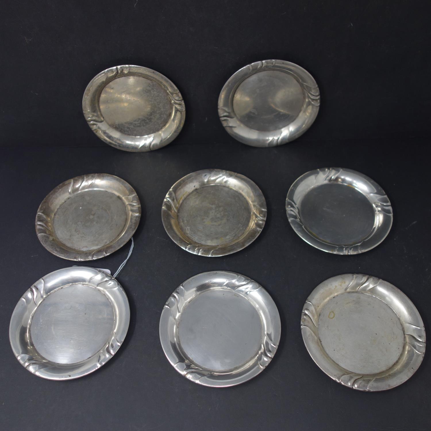 A set of eight silver coasters stamped 800, 20oz