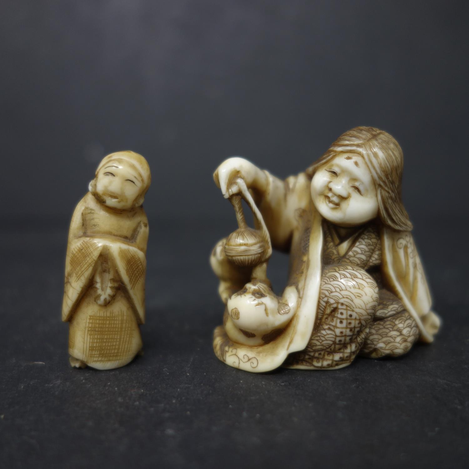 A 19th century Japanese ivory netsuke, hand carved with signature to base, together with a small