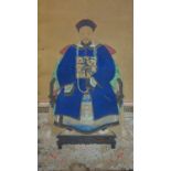 A late 19th/early 20th century Chinese painting of a scholar on silk mounted to board, with two silk
