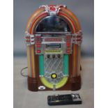 A CD Juke Box, with remote control, H.52 W.32 D.23cm