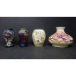Three small Moorcroft vases together with a Moorcroft squat vase