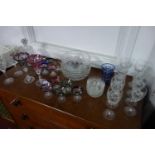 A collection of crystal to include coloured glass and bowls