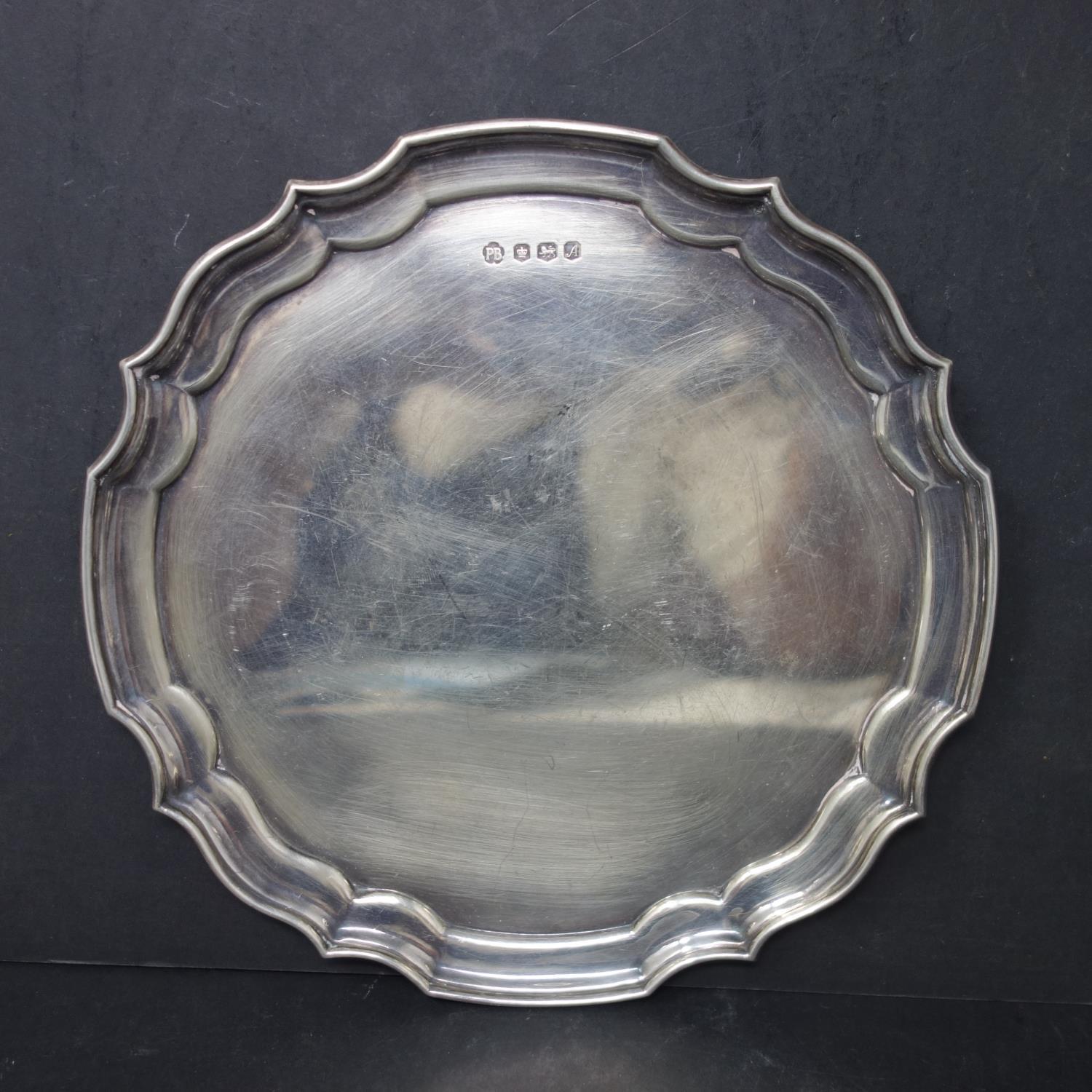A 20th century silver card tray, with initials P.B, dated 1975, 8oz