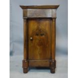 A 19th century walnut cupboard, with frieze drawer above cupboard door flanked by pillars, H.75 W.42