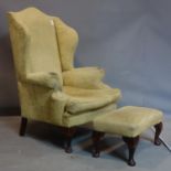 A Georgian style wing back armchair, with matching stool