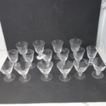 A set of 16 etched drinking glasses with crown over R mark