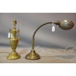 A vintage brass desk lamp with shell shade, together with a brass lamp of urn form