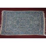 An Indian embroidered tapestry, turquoise floral design on a cream ground, 150 x 88cm