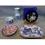 An early 20th century Chinese blue and white vase, together with a willow pattern platter, a