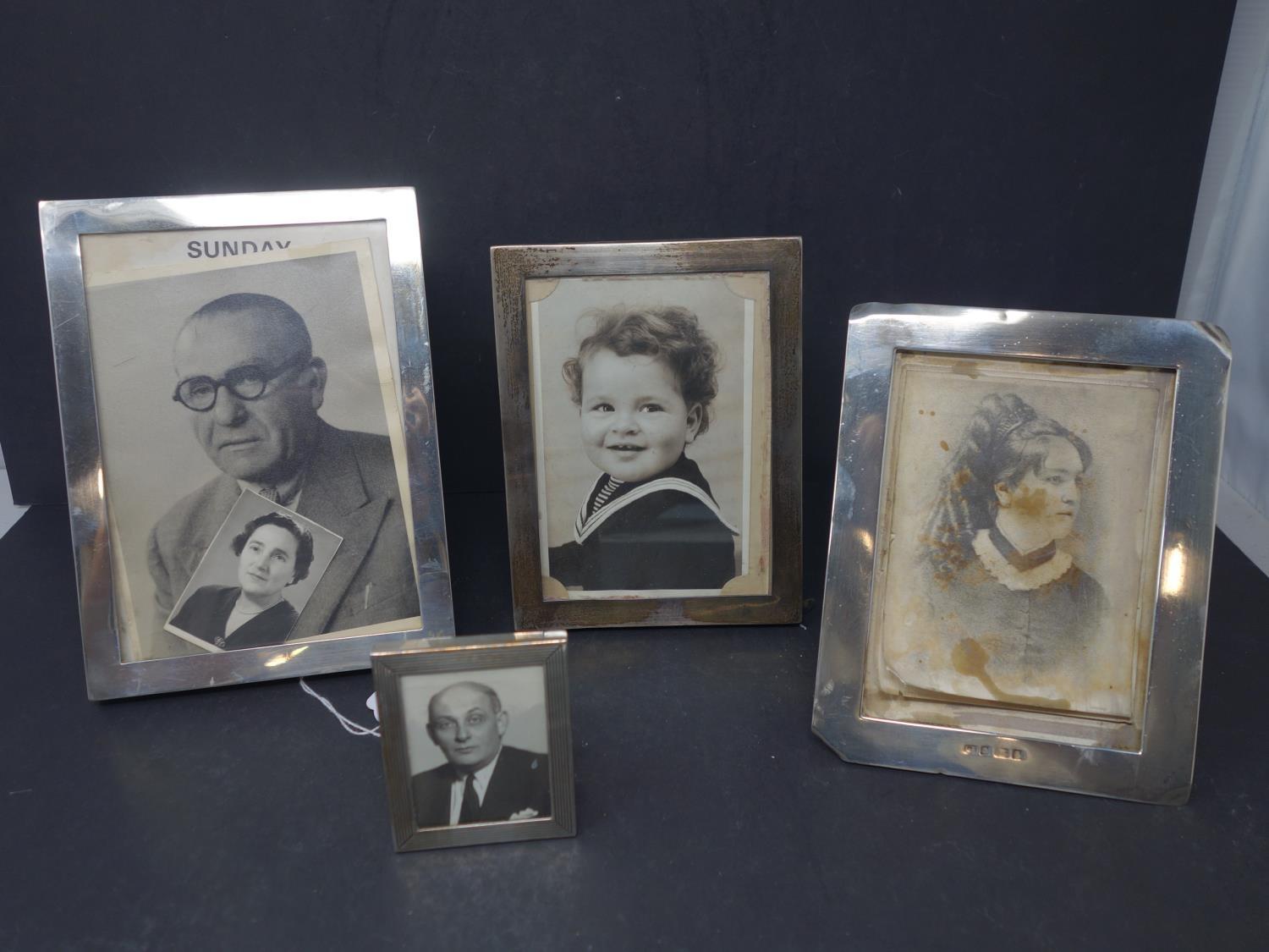 Four silver photograph frames
