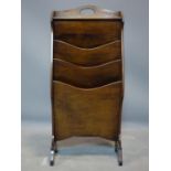 An early 20th century mahogany magazine rack, H.77 W.35 D.18cm