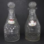 A pair of 19th century cut glass decanters, with enamel labels, H.28cm