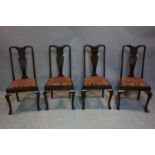 Four Edwardian mahogany dining chairs, with floral upholstery on cabriole legs