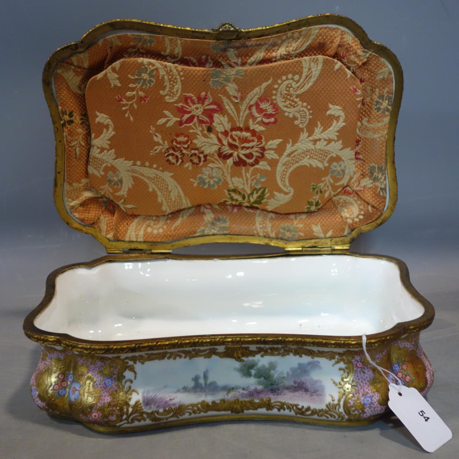 A late 19th/early 20th century hand painted porcelain casket, lid restored, H.10 W.32 D.22cm - Image 4 of 5