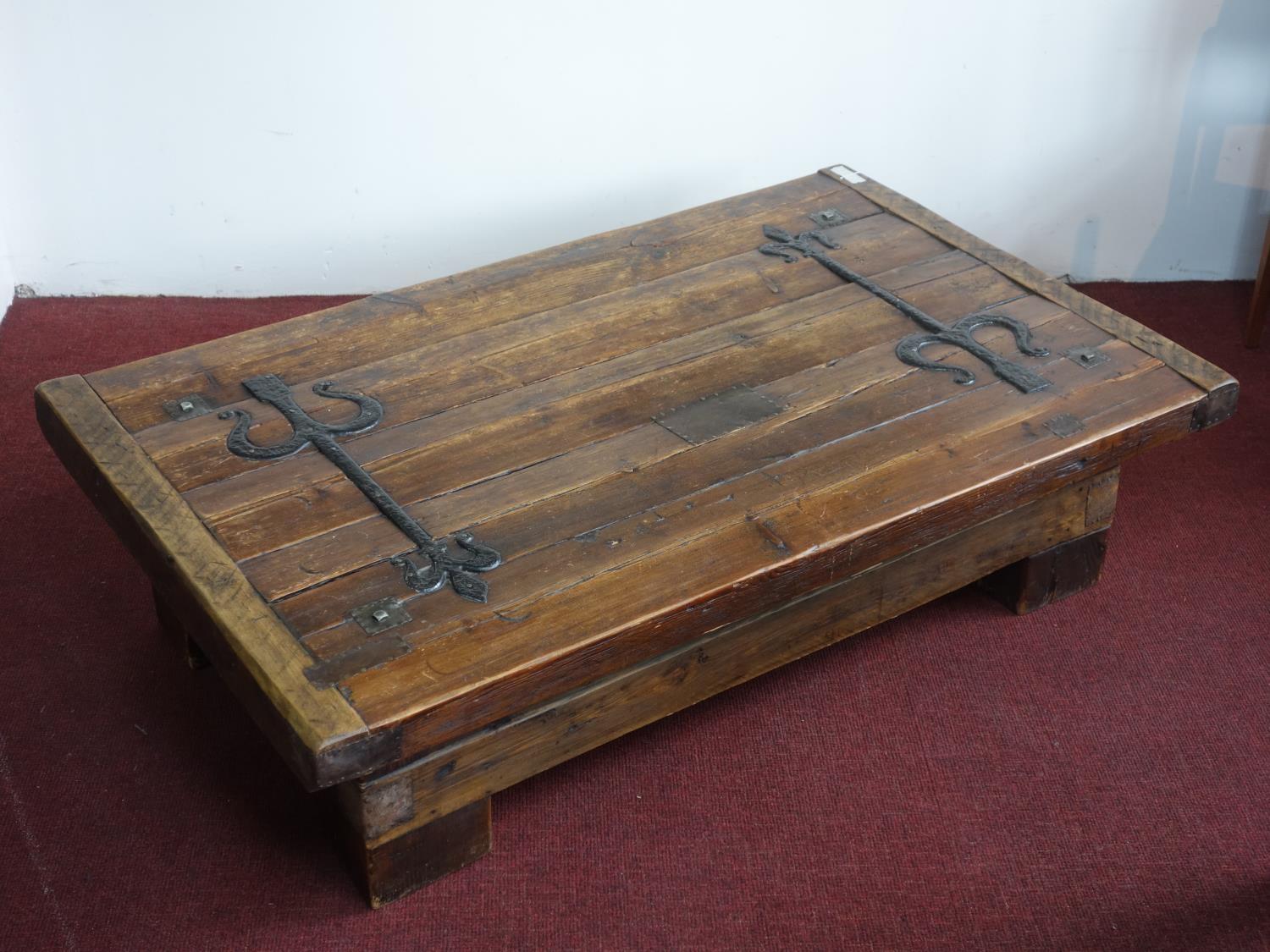 A large iron mounted pine coffee table, H.38 W.140 D.86cm