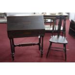 An oak bureau with desk chair