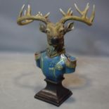 A moulded bust of a stag in military officer's uniform, 50 x 43cm