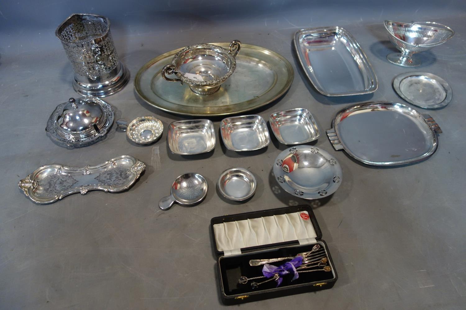 A collection of silver plated ware, to include a large oval tray, a wine coaster, a Harrods dish, an