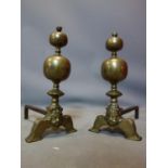 A pair of 19th century brass firedogs, H.44cm
