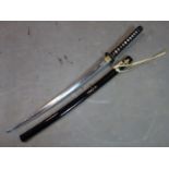 A Japanese samurai sword with gilt painted black lacquered sheath. 105cm