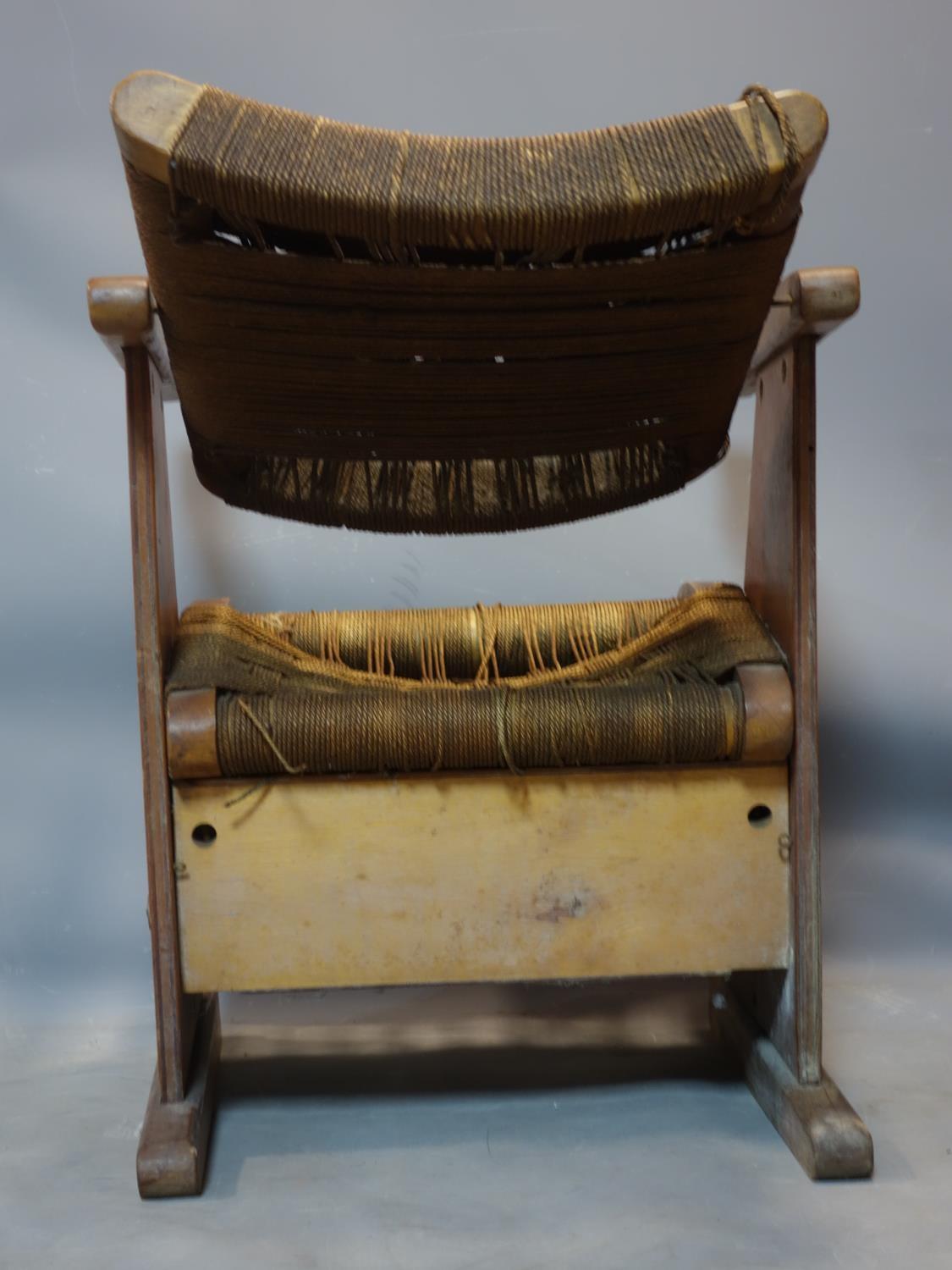 A vintage walnut and oak armchair with woven seat and back rest - Image 3 of 3