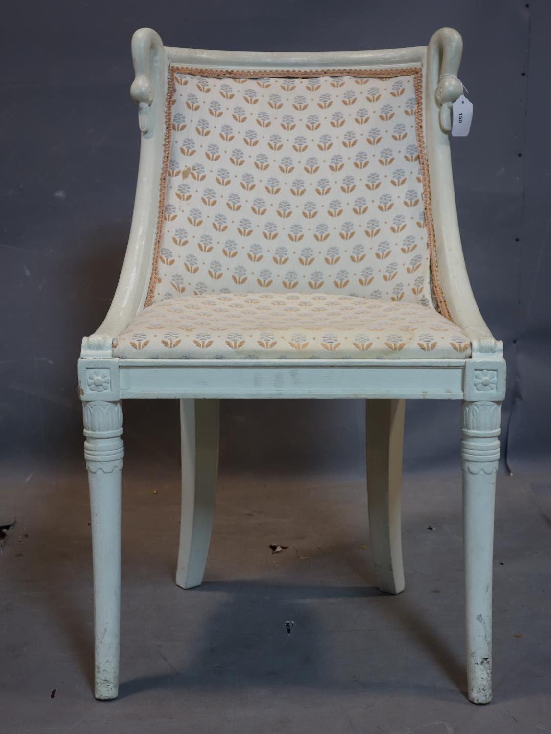 A Regency style white painted chair, with swan head finials