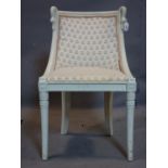 A Regency style white painted chair, with swan head finials