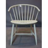 A 20th century Danish stick back chair, painted white, stamped made in Denmark