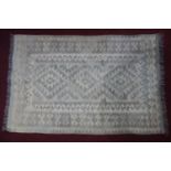 An Afghan kelim with repeating geometric motifs on a cream ground, 150 x 100cm