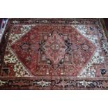 A Northwest Persian Heriz carpet, central diamond medallion with repeating geometric motifs on a