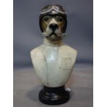 A moulded bust of a dog dressed as a racing driver, H.51cm