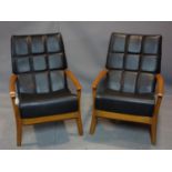 A pair of vintage beech wood armchairs with labels for T & L furniture