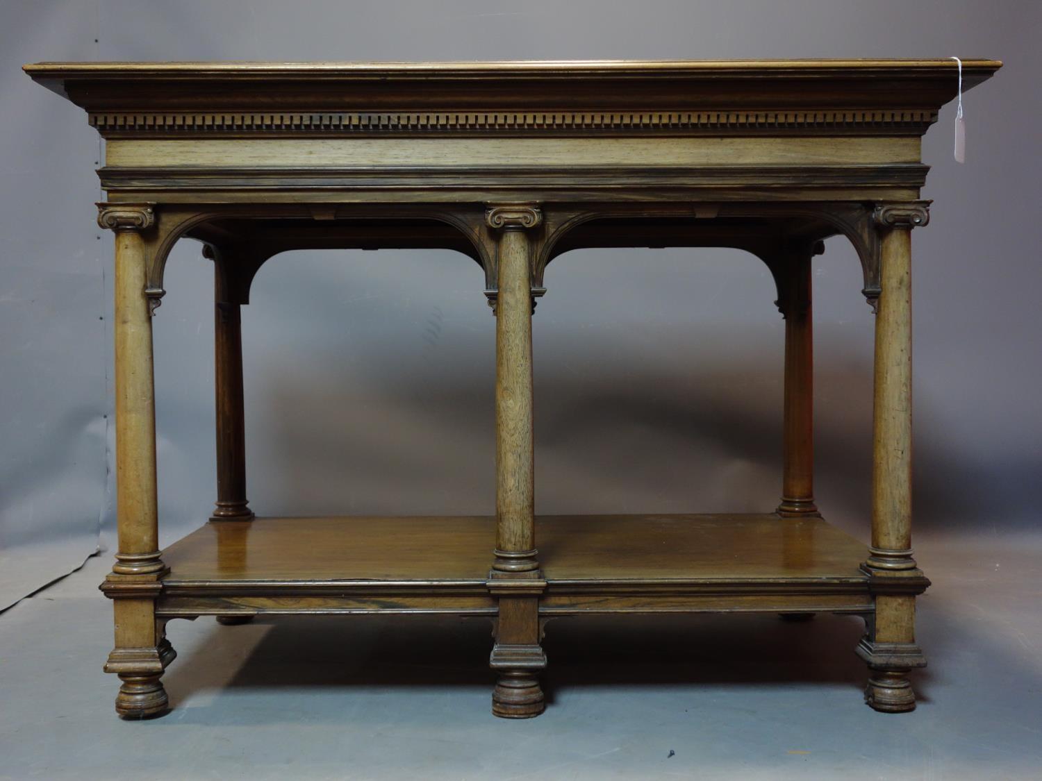 A 19th century Howard & Sons rosewood library table, with pillar supports and makers plaque, H.75