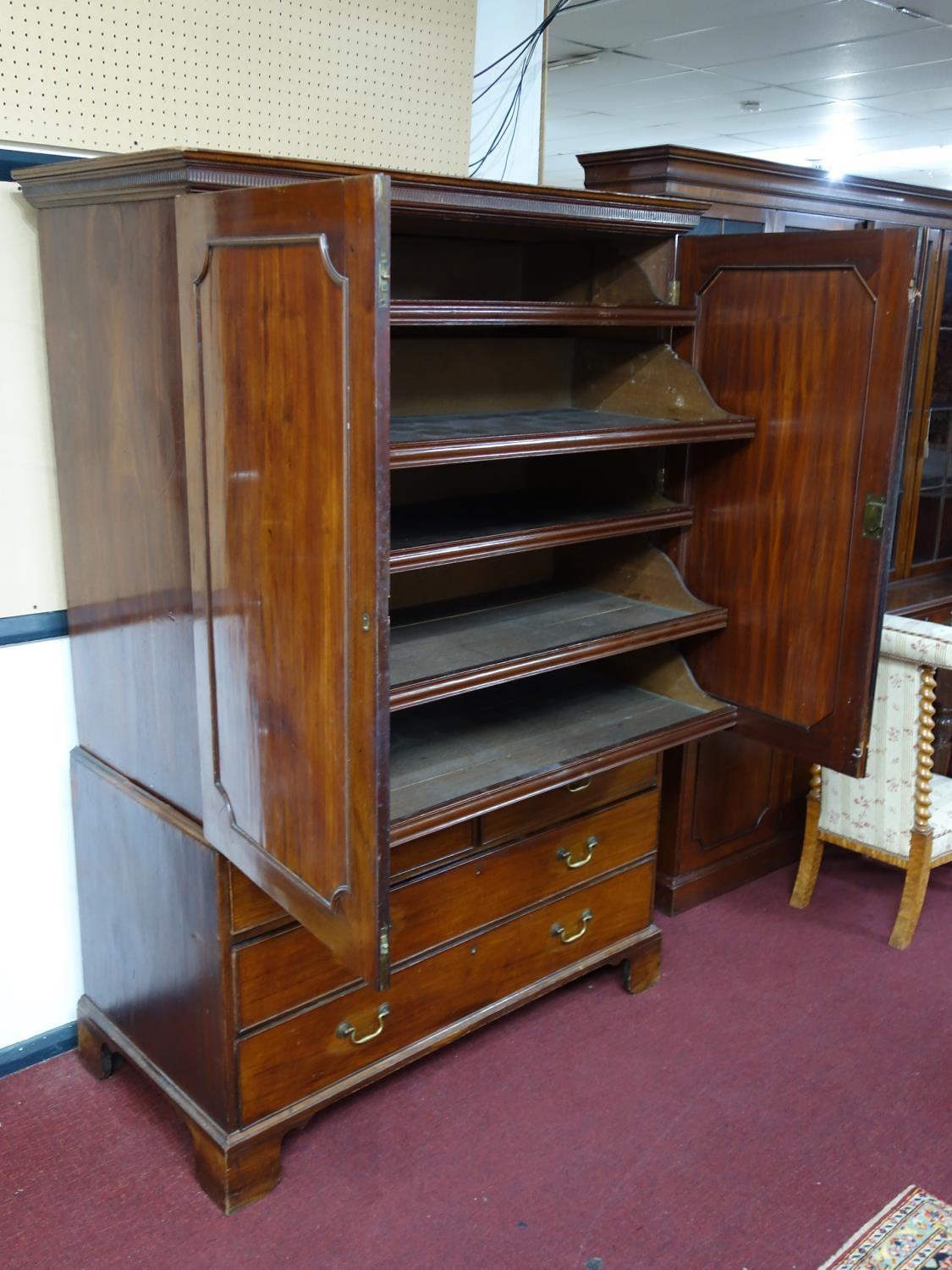 A late 18th century mahogany linen press, with 2 doors enclosing linen trays, above drawers, - Image 2 of 3