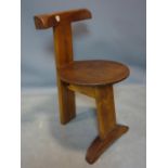 A vintage tribal style carved solid teak chair, with paper label for Johnson & sons Belfast