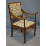 An Edwardian inlaid mahogany and satinwood crossbanded armchair, with sloped arms and floral